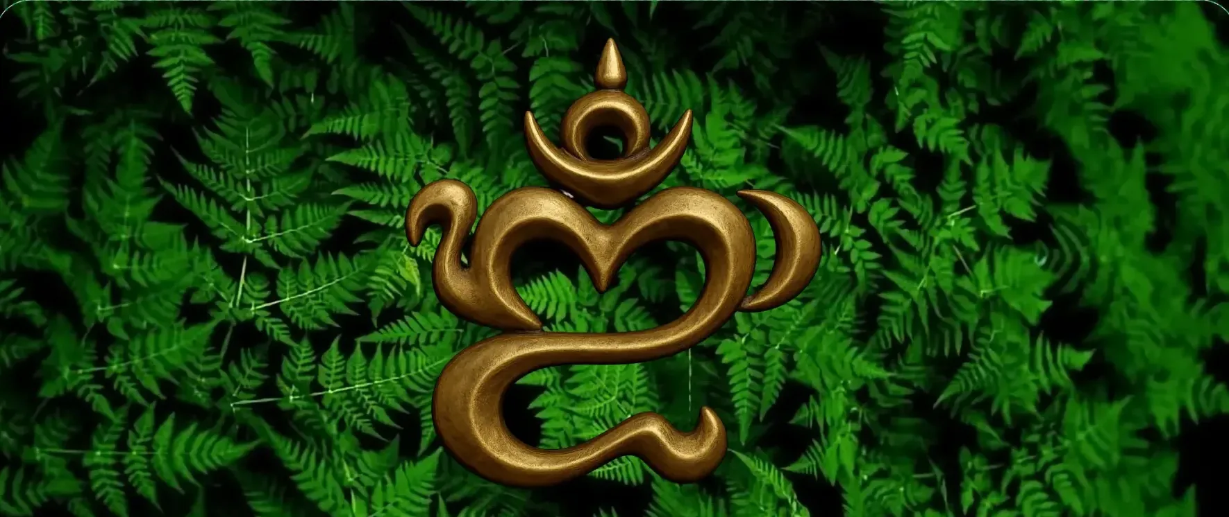 Gold Om-inspired symbol resting against dark green fern foliage